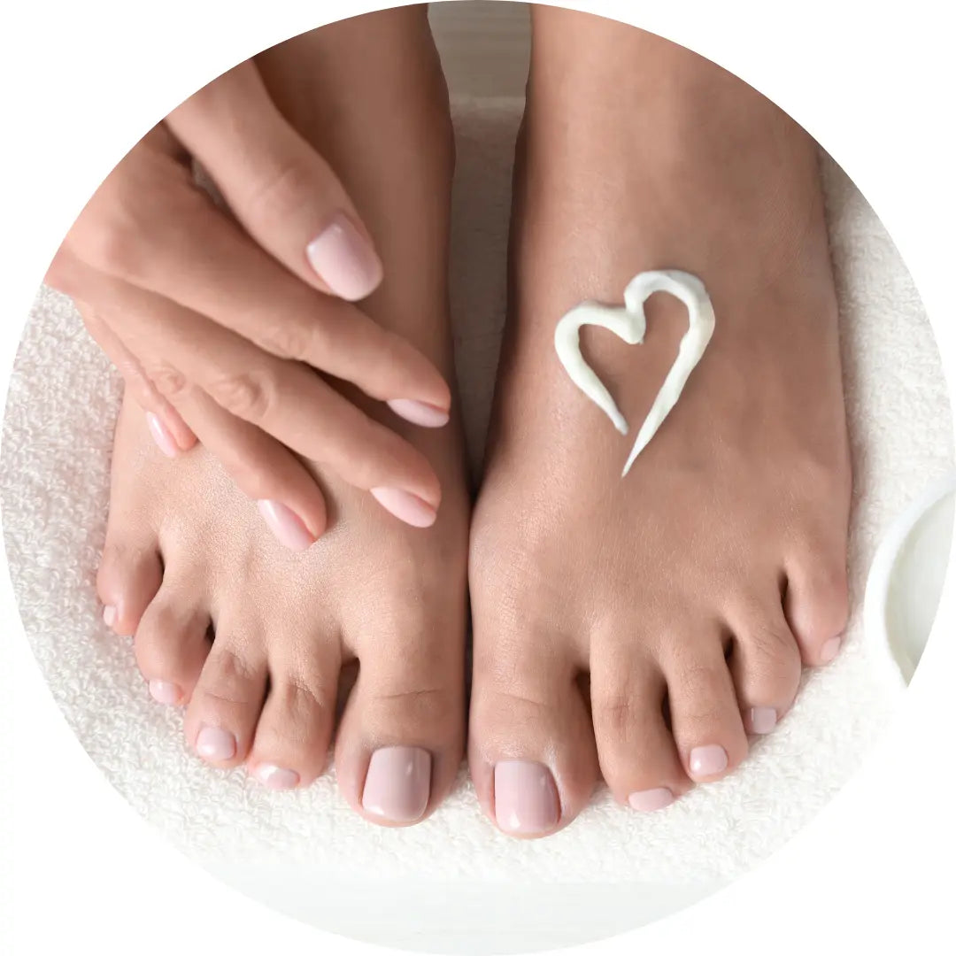 Buddha Beauty Vegan foot care range, womans feet with cream love heart on them