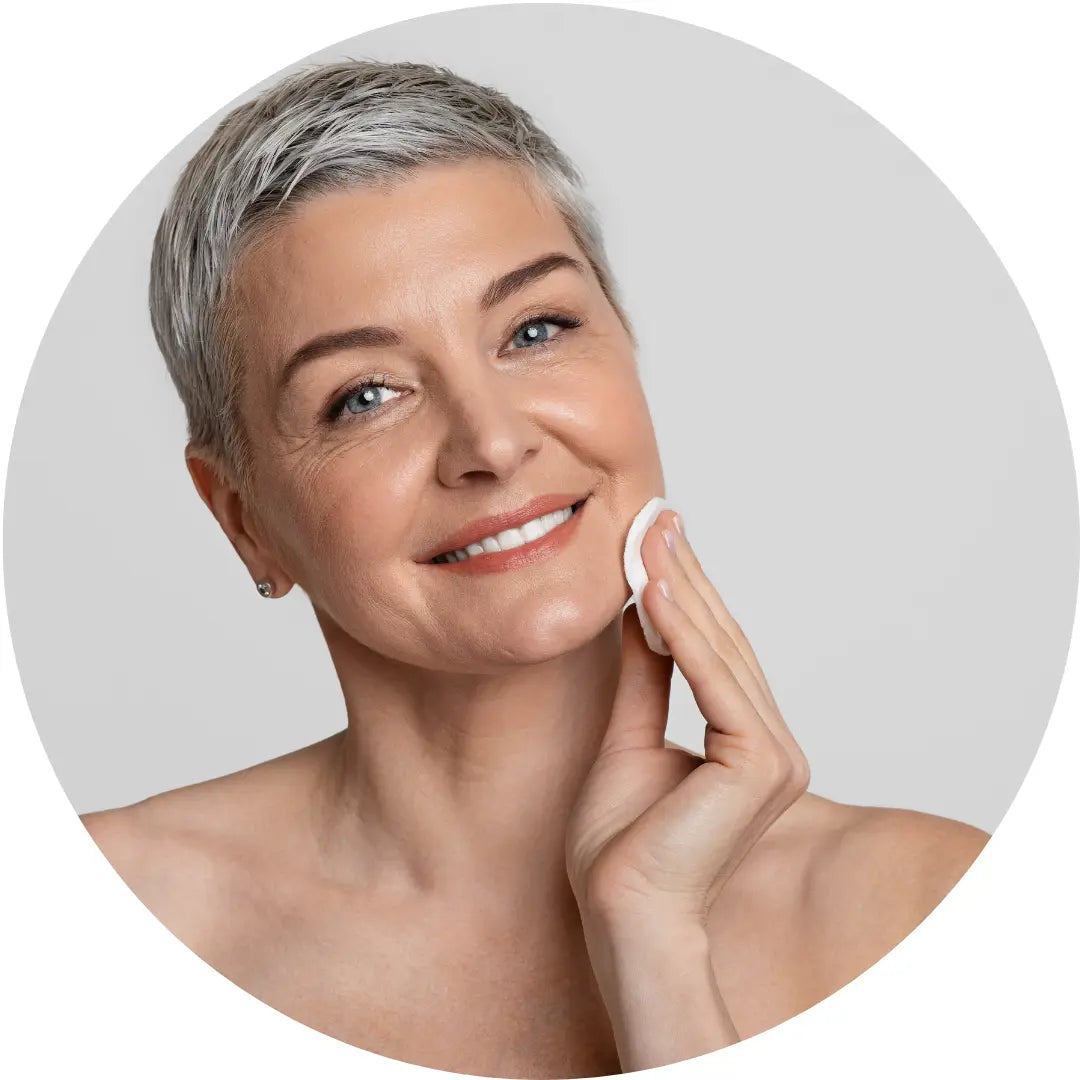 Buddha Beauty Skincare vegan and cruelty free dermaplane balm, woman wiping face 